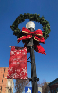 light pole wreath with banner and flocked bow